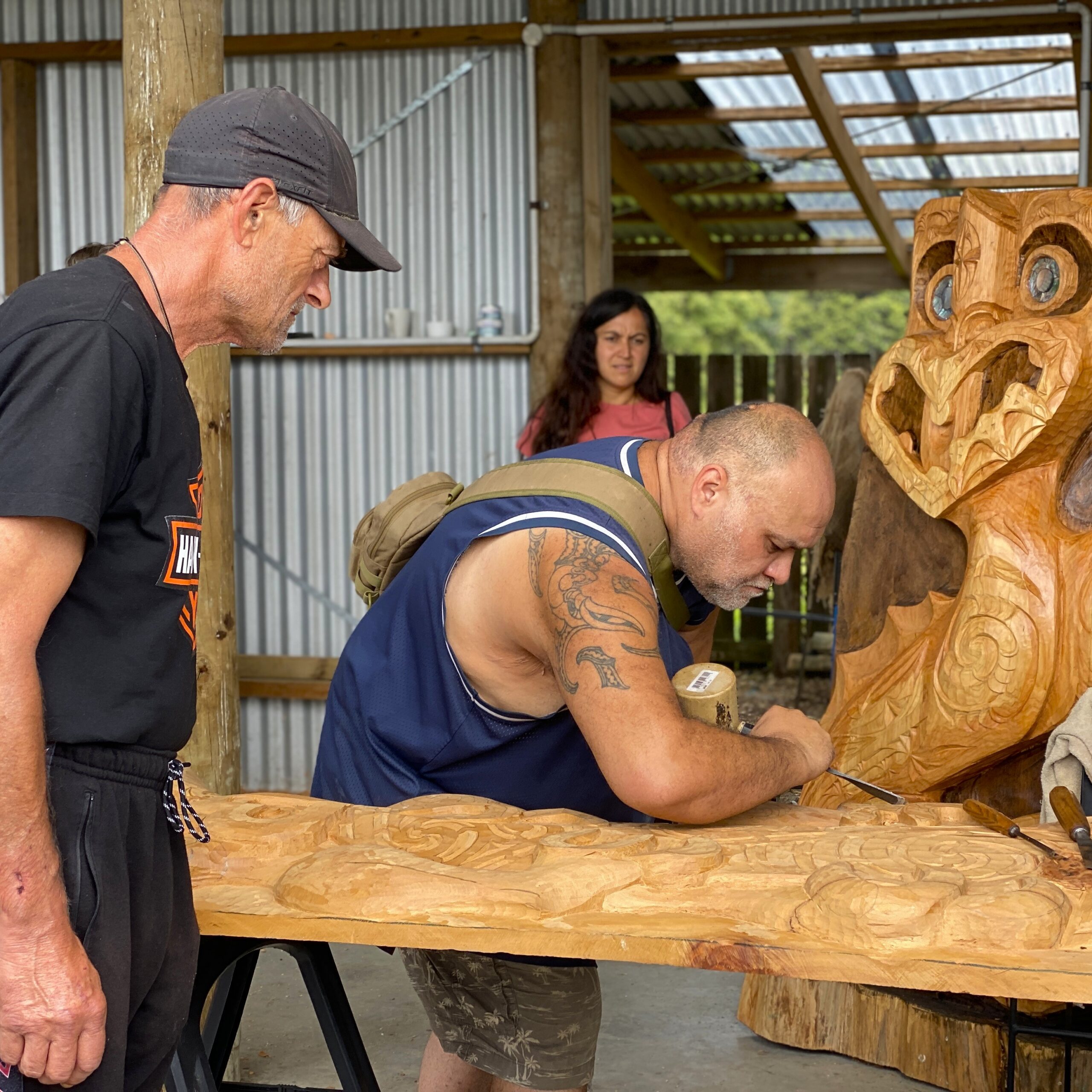Service pictured: Programme participants carving wood.